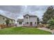 Spacious backyard featuring a well-maintained lawn and deck, creating an inviting outdoor space for gatherings and relaxation at 4567 Flanders Way, Denver, CO 80249
