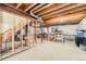 Unfinished basement framed with wood, with plumbing and exposed ceiling at 4567 Flanders Way, Denver, CO 80249