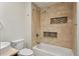 Bathroom with tile shower, built in niche, and bathtub at 6687 S Forest Way # E, Centennial, CO 80121