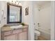 Bathroom featuring a vanity with granite countertops, a tub, and a shower at 6687 S Forest Way # E, Centennial, CO 80121