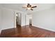 Spacious bedroom with hardwood floors leading to bathroom and closet at 6687 S Forest Way # E, Centennial, CO 80121