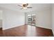 Spacious bedroom with hardwood floors and a sliding glass door to the outside at 6687 S Forest Way # E, Centennial, CO 80121