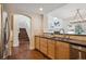 Open kitchen flows to staircase and dining area, perfect for entertaining at 6687 S Forest Way # E, Centennial, CO 80121