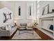 Spacious living room with large windows, hardwood floors, and stylish furnishings at 6687 S Forest Way # E, Centennial, CO 80121