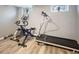 Basement workout area with an exercise bike and treadmill at 2995 Albion St, Denver, CO 80207