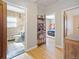 Bathroom and bedroom entrances through the home's hallway at 2995 Albion St, Denver, CO 80207