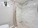 The bathroom features white marble tiling in the shower area and a pebble floor at 2995 Albion St, Denver, CO 80207