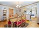 Cozy dining room with hardwood floors and open view into the kitchen featuring stylish decor throughout at 2995 Albion St, Denver, CO 80207