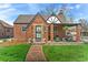 Charming brick home with a well-manicured lawn and a cozy covered porch perfect for relaxing at 2995 Albion St, Denver, CO 80207
