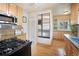 Modern kitchen with stainless steel appliances, including a refrigerator and ample counter space at 2995 Albion St, Denver, CO 80207