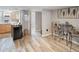 Kitchen with light wood cabinets, stainless steel appliances, and adjacent dining area at 2995 Albion St, Denver, CO 80207
