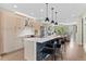 Open kitchen with bar seating that transitions into the bright and spacious Gathering room at 3885 Vrain St, Denver, CO 80212