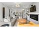 Open-concept living room with hardwood floors and a modern fireplace at 3885 Vrain St, Denver, CO 80212