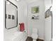 Modern powder room featuring a sleek mirror, stylish fixtures, and contemporary design at 3885 Vrain St, Denver, CO 80212