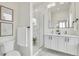 Modern bathroom with double vanity, glass enclosed shower, and elegant fixtures, offering a spa-like experience at 9081 Westminster Blvd, Westminster, CO 80031