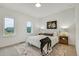 Bright bedroom with large windows, modern decor, and minimalist style, creating a peaceful and inviting retreat at 9081 Westminster Blvd, Westminster, CO 80031