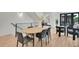 Contemporary dining area with stylish furniture and decor, adjacent to the staircase at 9081 Westminster Blvd, Westminster, CO 80031