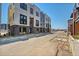 Modern townhome exterior with brick accents, large windows, and sleek contemporary design at 9081 Westminster Blvd, Westminster, CO 80031