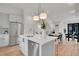 Open kitchen layout featuring stainless steel appliances, white cabinets, and a dining area at 9081 Westminster Blvd, Westminster, CO 80031