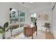 Bright office featuring a large window, modern desk, and neutral tones at 9081 Westminster Blvd, Westminster, CO 80031