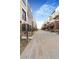 Modern townhomes line a street with landscaped sidewalks offering a desirable community setting at 9081 Westminster Blvd, Westminster, CO 80031