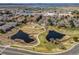 Aerial view of community featuring water features, green spaces, and walking paths at 13950 E Oxford Pl # B105, Aurora, CO 80014