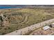 Aerial view of community featuring natural setting, lake, and highway at 13950 E Oxford Pl # B105, Aurora, CO 80014