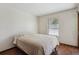 Cozy bedroom featuring a large window, providing ample natural light and a serene atmosphere at 13950 E Oxford Pl # B105, Aurora, CO 80014