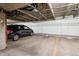 Garage with parking spot and storage spaces behind marked doors at 13950 E Oxford Pl # B105, Aurora, CO 80014