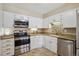 Well-maintained kitchen featuring stainless steel appliances, granite countertops, and ample cabinet space at 13950 E Oxford Pl # B105, Aurora, CO 80014