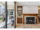 The living room offers fireplace, built-in shelving, and access to the outdoor patio at 13950 E Oxford Pl # B105, Aurora, CO 80014
