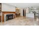 Open living space with fireplace, dining area, and kitchen bar, perfect for modern living and entertaining at 13950 E Oxford Pl # B105, Aurora, CO 80014