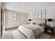 Serene main bedroom with contemporary decor, plush bedding, and lots of natural light at 13950 E Oxford Pl # B105, Aurora, CO 80014