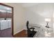 Bright office space next to laundry room featuring a glass desk at 13950 E Oxford Pl # B105, Aurora, CO 80014
