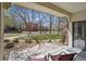 Relaxing patio space with a view of mature trees and landscaping at 13950 E Oxford Pl # B105, Aurora, CO 80014