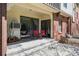 Cozy patio with seating area, sliding glass doors, and direct access to the building at 13950 E Oxford Pl # B105, Aurora, CO 80014