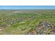 Aerial view features houses and golf course in a green community at 42073 Colonial Trl, Elizabeth, CO 80107