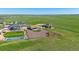 Beautiful aerial view of a property highlighting its fenced yard, basketball court, and tranquil location at 42073 Colonial Trl, Elizabeth, CO 80107