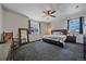 Cozy bedroom with carpet, ceiling fan, two windows and furnishings at 42073 Colonial Trl, Elizabeth, CO 80107
