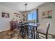 Bright dining room featuring stylish light fixture, decor, and tile flooring at 42073 Colonial Trl, Elizabeth, CO 80107