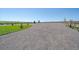 Picturesque driveway view with lush green grass and mature trees in a rural setting at 42073 Colonial Trl, Elizabeth, CO 80107