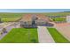 Charming home with stone accents, well-manicured lawn, and long driveway leading to a two-car garage at 42073 Colonial Trl, Elizabeth, CO 80107