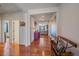 Stylish hallway boasts wood floors, neutral walls, and opens to the living room, creating a warm ambiance at 42073 Colonial Trl, Elizabeth, CO 80107