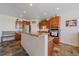 Inviting kitchen featuring granite countertops, stainless steel appliances, and wood cabinets at 42073 Colonial Trl, Elizabeth, CO 80107