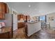 Spacious kitchen features granite countertops, wood cabinets, and an eat-in area with natural light and backyard views at 42073 Colonial Trl, Elizabeth, CO 80107