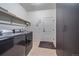 Functional laundry room with a washer, dryer, and convenient storage space at 42073 Colonial Trl, Elizabeth, CO 80107