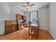Office featuring hardwood floors, natural light, a desk, and office furniture at 42073 Colonial Trl, Elizabeth, CO 80107