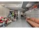 Unfinished basement with storage, exposed pipes, a bicycle, and a leather sofa at 1152 S Yosemite Way # 29, Denver, CO 80247