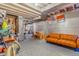Unfinished basement area with exposed ceiling, concrete wall, and vintage furnishings at 1152 S Yosemite Way # 29, Denver, CO 80247