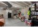 Unfinished basement with storage, a bicycle, and a leather sofa and overhead lighting at 1152 S Yosemite Way # 29, Denver, CO 80247